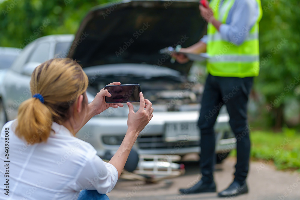 Car accident damaged by hand using smartphone to take pictures. Car accident damaged by hand using smartphone to take pictures.