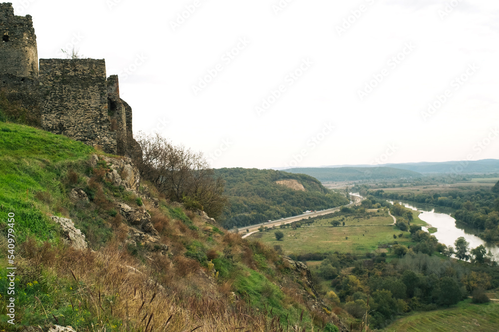 Ruins of medieval mountain Romanian castle Şoimoş Fortress (Cetatea Soimos Lipova Arad Romania) and valley of river Mures