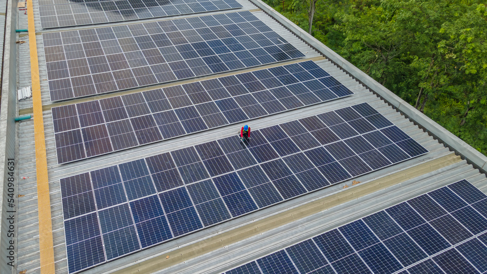 Engineer service and workers installation solar cell on the roof of factory industry. technician inspection on the roof of factory Engineer service and workers installation solar cell on the roof of factory industry. technician inspection on the roof of factory