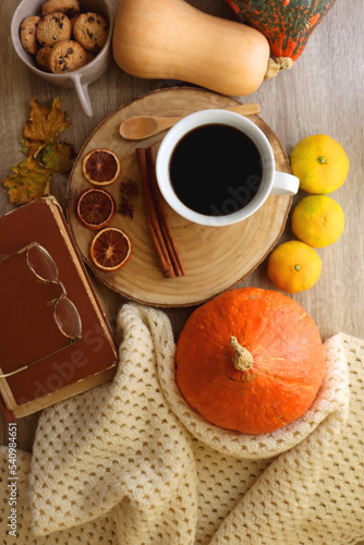 Wallpaper Mural Cup of tea or coffee, seasonal spices, bowl of cookies, blanket, pumpkins, colorful leaves, books and tangerines on wooden table. Cozy hygge at home. Top view. Torontodigital.ca