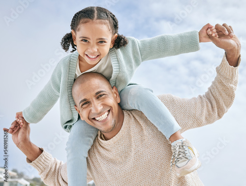 Love, father and girl on back, happy and bonding with smile, relax and playing together outdoor for travel. Portrait, parent and dad with daughter or carry child, embrace and fun with kid, happiness. © J Maas/peopleimages.com