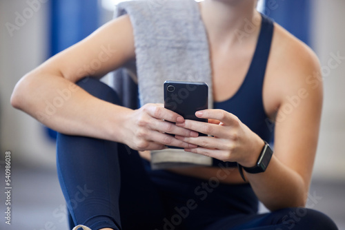 Fitness, smartphone or relax body of woman typing, scroll or browse health app, wellness blog post or social media gym feed. Girl hands of digital mobile user search web for training workout exercise