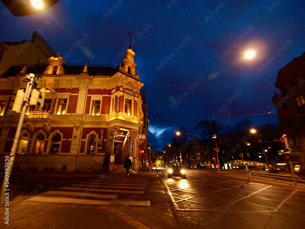 Helsinki, Finland, February 2018 - A traffic light on a city street at night
