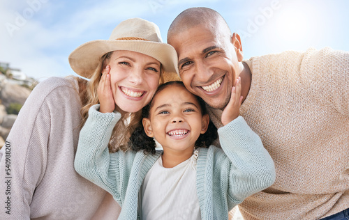 Family, smile and face portrait in nature on holiday, vacation or summer trip. Diversity, travel and parents, father and mother with girl, love and care, spending quality time together and bonding. #540988207