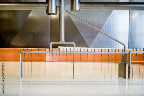 фотографія Cheesemaking in Switzerland, closeup on machine