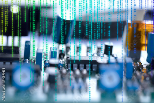 Close-up electronic circuit board with binary code. Defocused background with copy space. Computer technologies and details. Technique, technology, electronics, device.