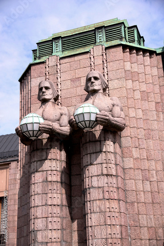 Helsinki, Finland, February 2018 - A statue in front of a brick building