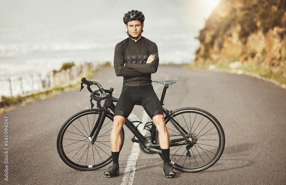 Man, cycling and mountain bike with arms crossed for sports exercise, training and fitness in nature. Portrait of a confident male professional cyclist standing by a bike for cycle tour outdoors Man, cycling and mountain bike with arms crossed for sports exercise, training and fitness in nature. Portrait of a confident male professional cyclist standing by a bike for cycle tour outdoors