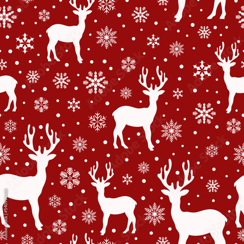 Christmas animal seamless pattern with reindeer silhouette, snowflakes and snow. Prints, packaging template, wrapping paper, textiles and wallpaper. © Nikola