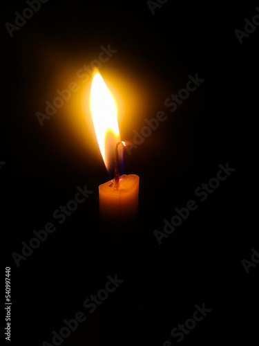 candle lit in the dark night