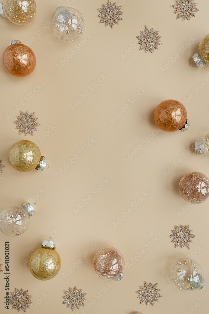 Christmas, New Year holidays composition. Frame with blank copy space. Gold Christmas baubles balls, stars on neutral beige background. Flat lay, top view festive mockup Christmas, New Year holidays composition. Frame with blank copy space. Gold Christmas baubles balls, stars on neutral beige background. Flat lay, top view festive mockup