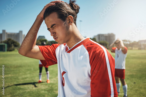 Sport fail, soccer team loss and athlete angry about sports game results on a outdoor field. Football, soccer player and teamwork upset after exercise, workout and training for fitness and cardio © Allistair F/peopleimages.com