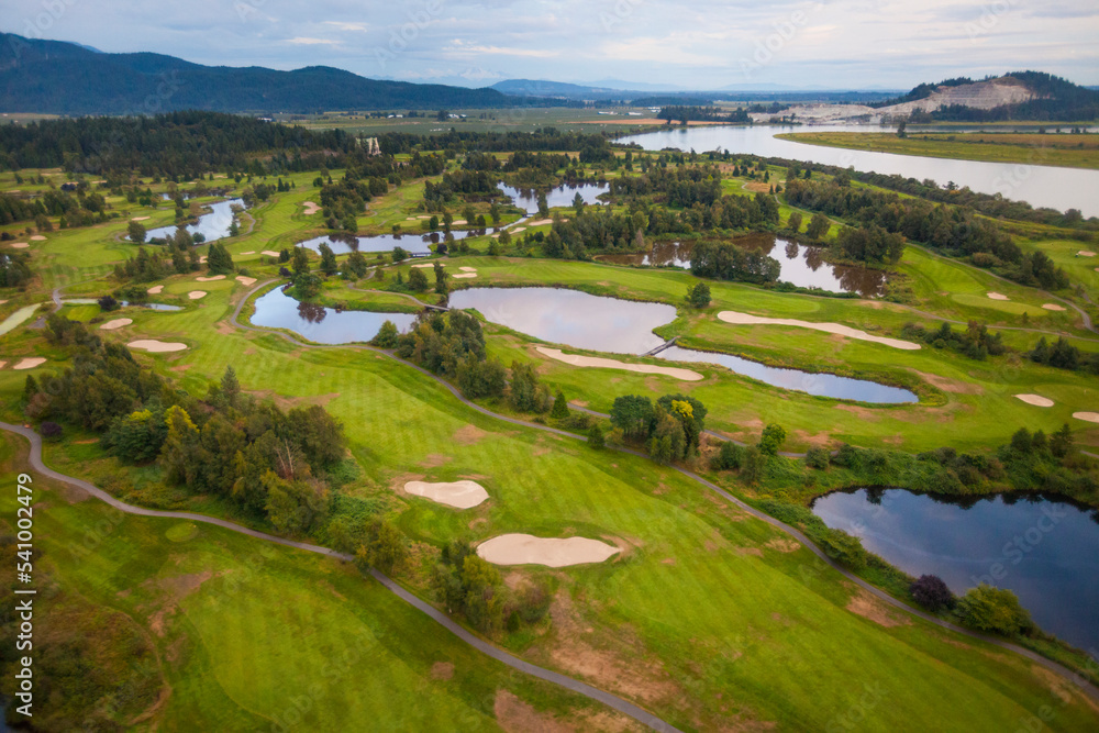 Aerial view of golf course in mountains Aerial view of golf course in mountains