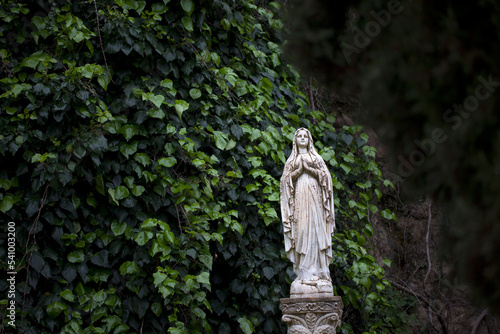 A sculpture of the Virgin Mary decorates a garde in Zahara de la Sierra, Sierra de Grazalema Natural Park, Cadiz province, Andalusia, Spain photo