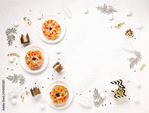 Roscon de Reyes, Spanish Three Kings Christmas Sweet Cake with winter decorations on white background