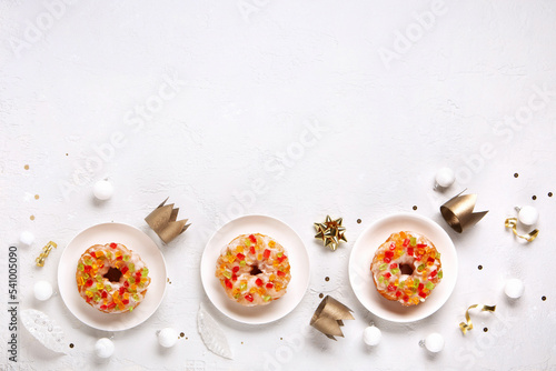 Roscon de Reyes, Spanish Three Kings Christmas Sweet Cake with winter decorations on white background