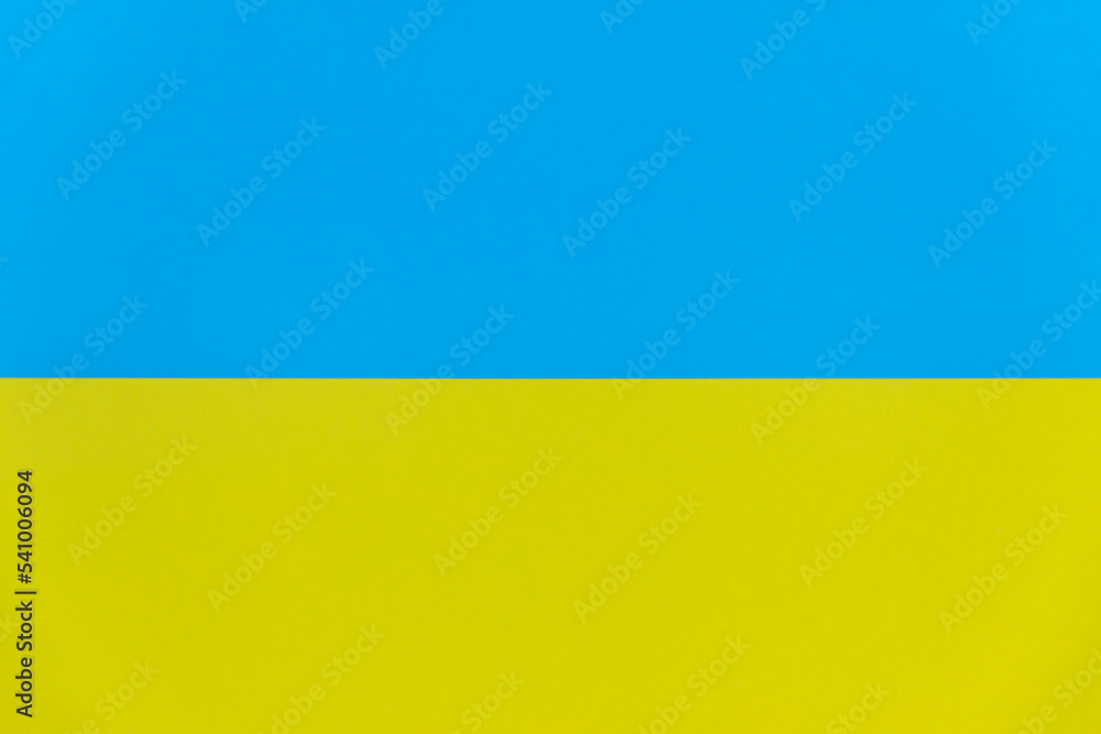 Horizontal blue and yellow flag of Ukraine, UA flag made of cardboard Horizontal blue and yellow flag of Ukraine, UA flag made of cardboard