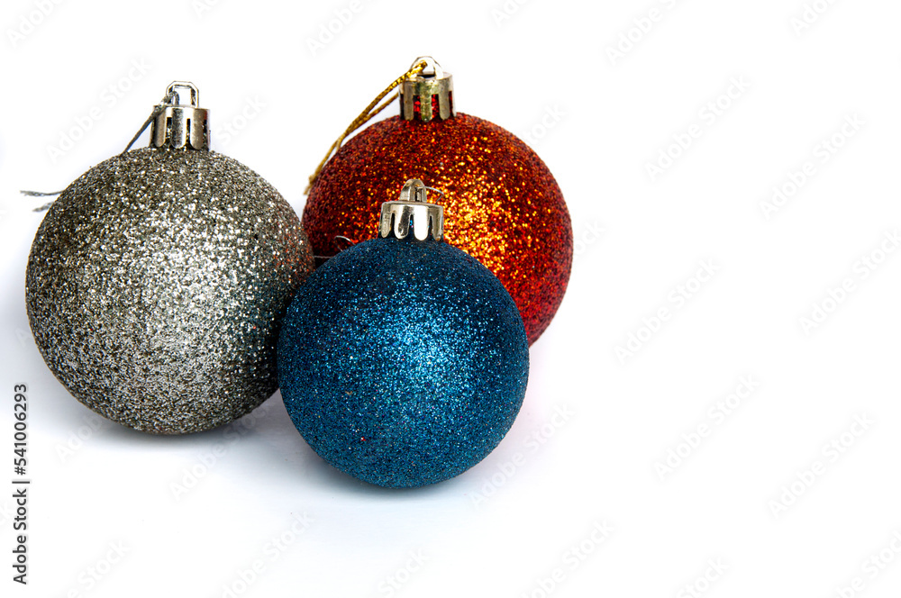 Christmas balls and stars decoration on white background with customizable space for Christmas message or wishes. Copy space. Christmas balls and stars decoration on white background with customizable space for Christmas message or wishes. Copy space.