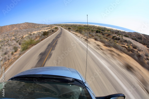 Driving south on Hwy 1 - the Pacific Coast Highway - from Todos Santos to Cabo San Lucas in Baja, Mexico. photo