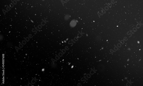 Falling snow isolated on black background © Vuang