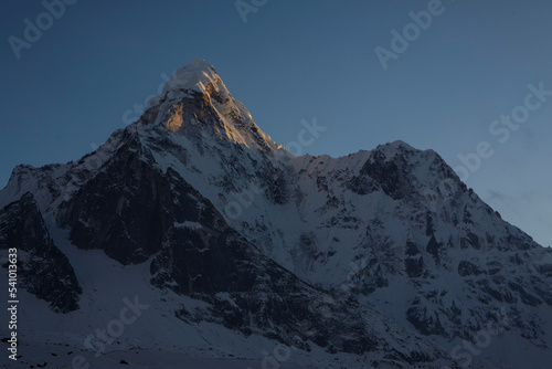 Alpenglow on the summit of Ama Dablam in Nepal's Khumbu Valey. photo