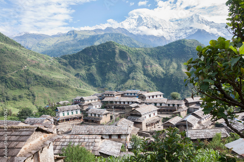View of ghandruk village with mountain ranges in background, Nepal photo