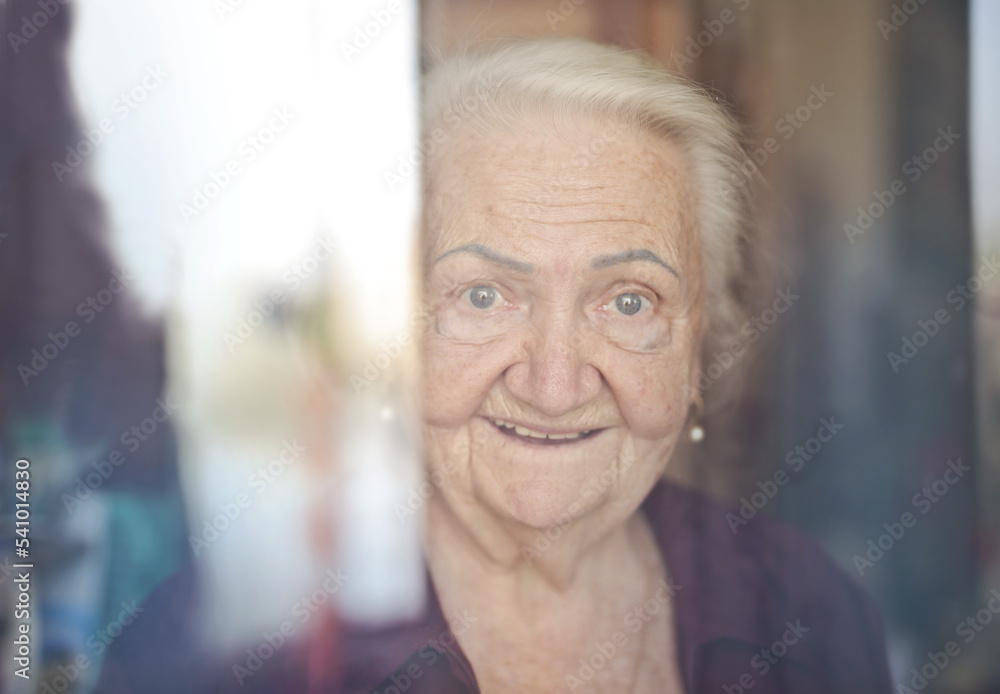 portrait of elderly lady through the glass portrait of elderly lady through the glass