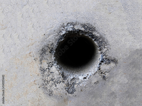 Background texture of cement wall with hole in the middle