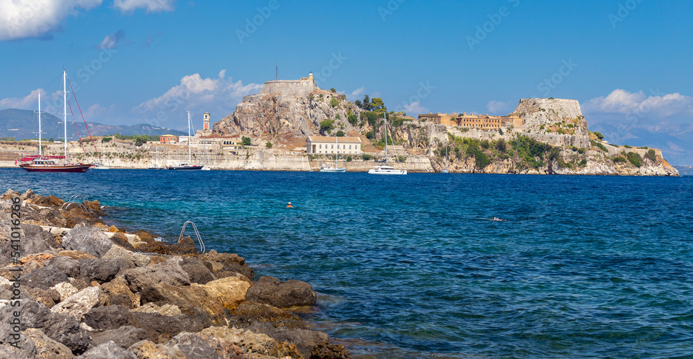 Kerkyra. Greece. View of the coastline and ships on a sunny day.
