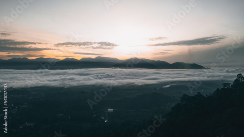 Sea clouds during golden sunrise above the mountains range in Lenggong, Perak.