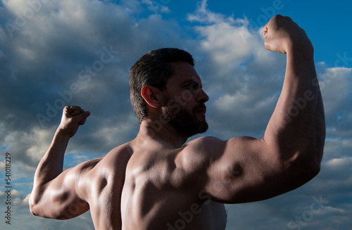 strong shirtless man. bodybuilder man with muscular torso. sportsman man with biceps and triceps