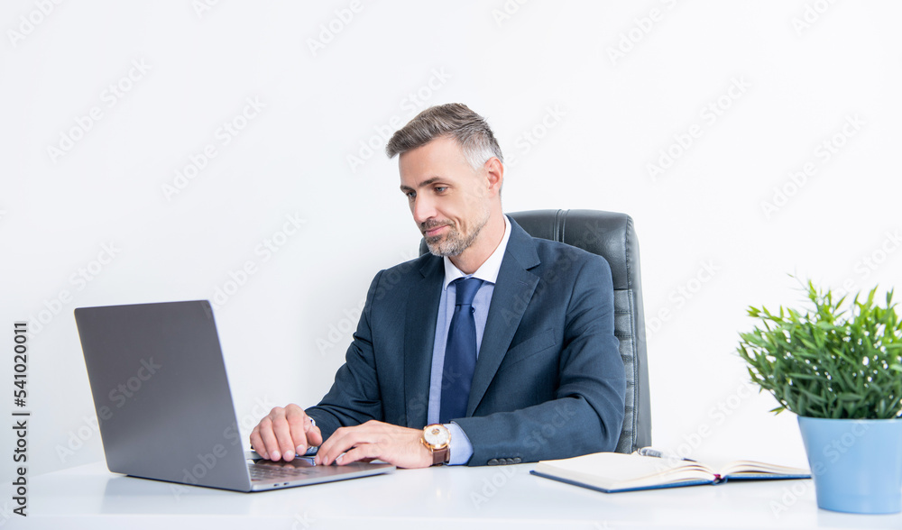 mature man wear suit in business office with laptop mature man wear suit in business office with laptop