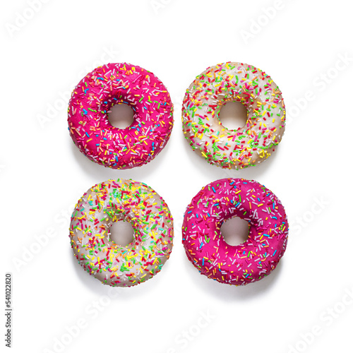 Top view of four glazed donuts on a white background