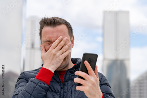 Photos Mature man from grief covered his face with his hand to hide from the received i