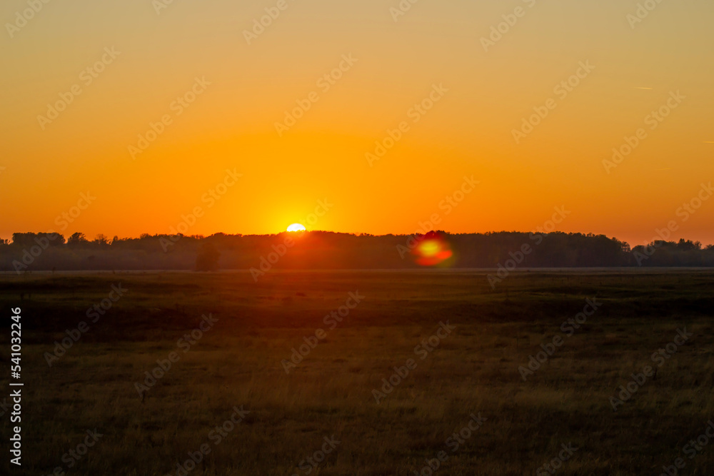 sunset over the grassland
