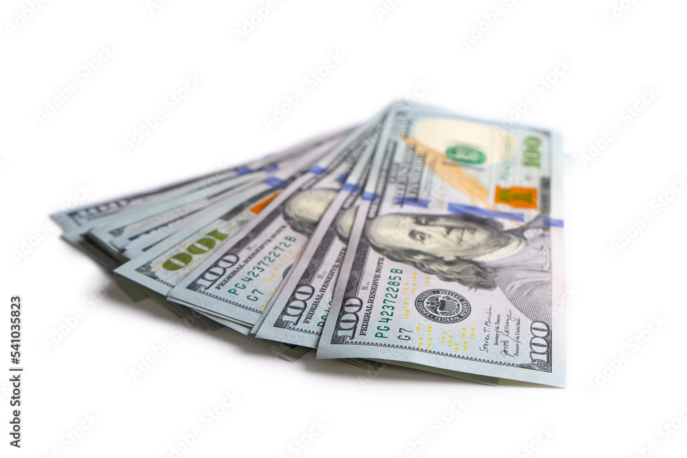 Pile of new design US dollar bills isolated on white background. Hundreds of dollar cash banknotes. Top view, flat lay. Business, finance, bank, currency, economy, wealth concept Pile of new design US dollar bills isolated on white background. Hundreds of dollar cash banknotes. Top view, flat lay. Business, finance, bank, currency, economy, wealth concept
