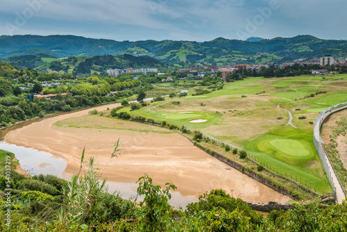 Aerial view to the river, golf field and city on a beautiful summer day © Canvas Alchemy