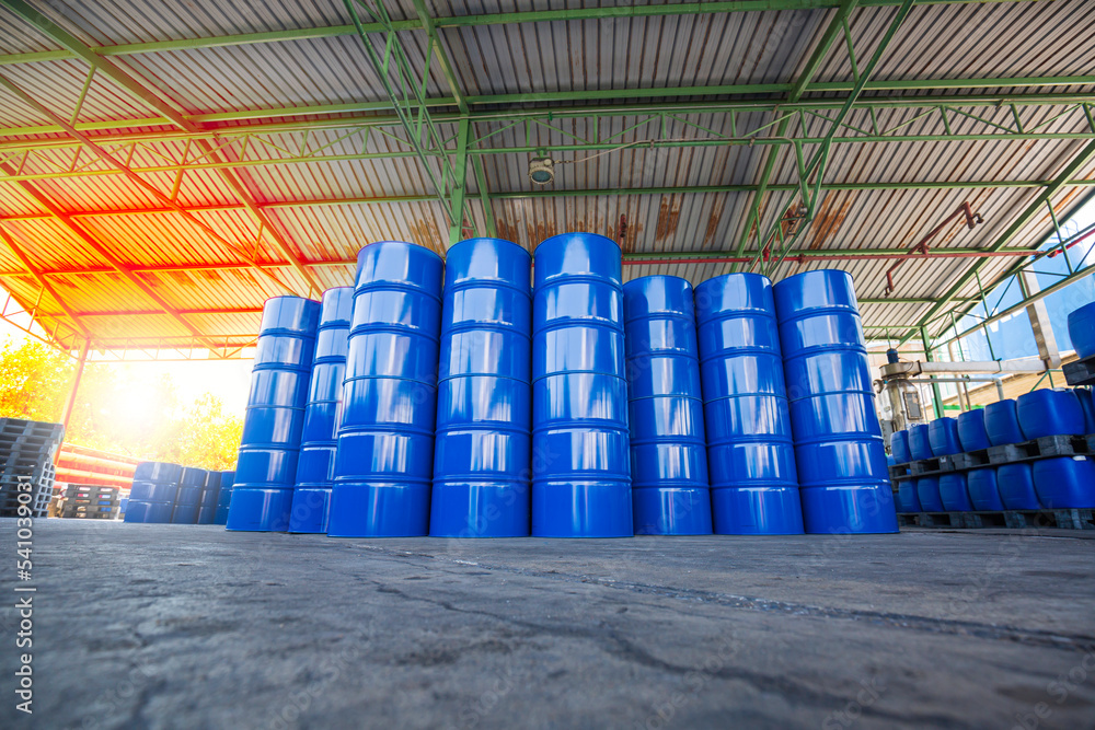 Oil barrels blue or chemical drums vertical stacked up Oil barrels blue or chemical drums vertical stacked up