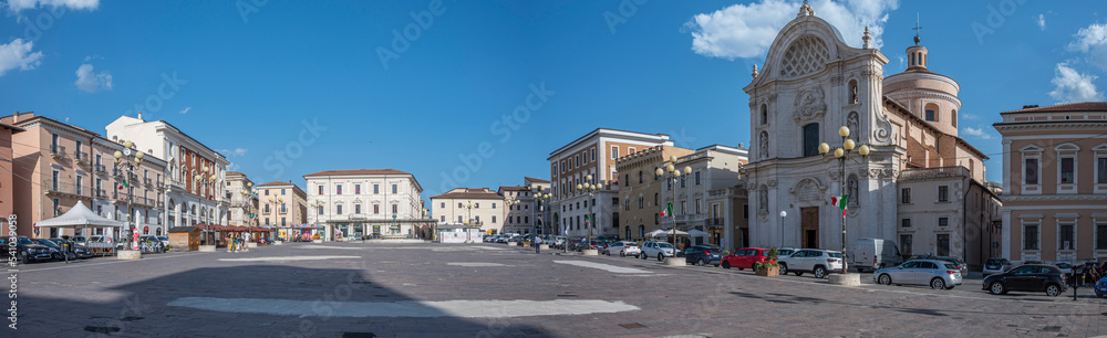 Extra wide angle view of the beautiful Piazza Duomo in L'Aquila with historic buildings and churches