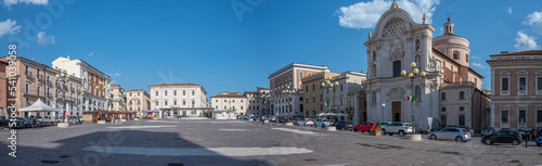 Extra wide angle view of the beautiful Piazza Duomo in L'Aquila with historic buildings and churches