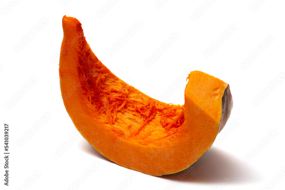 A slice of ripe pumpkin on a white background A slice of ripe pumpkin on a white background
