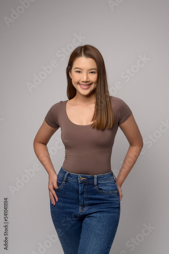 Portrait of young beautiful woman smiling over white background studio © tonefotografia