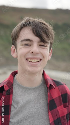Portrait of teenager boy smiling and looking at camera
