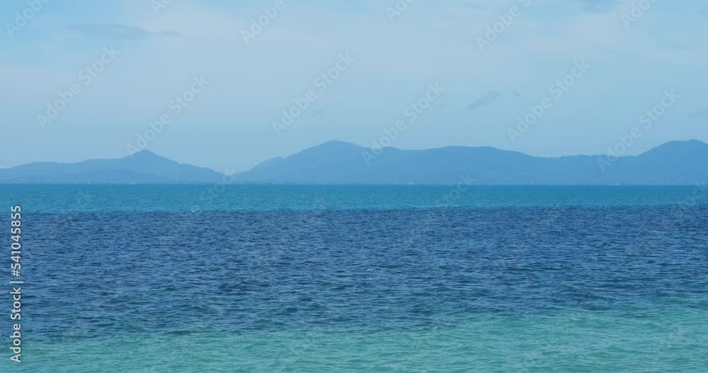 View to a beautiful Ocean with mountain silhouette on the background. Adventure. Travel destination, World tourism concept View to a beautiful Ocean with mountain silhouette on the background. Adventure. Travel destination, World tourism concept