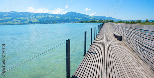 Fototapeta Naklejka Na Ścianę i Meble -  wooden footbridge lake Obersee, Rapperswil Jona to Hurden
