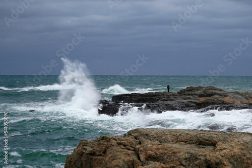 Waves crashing on the rocks along the shore