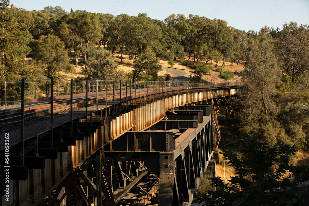 Vægklistermærke Sunset view of the historic train trestle of downtown Auburn, California, USA