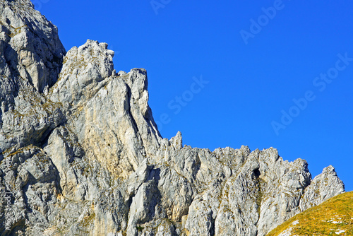 Sharp rocks of the Sleme mountain range against the blue sky in the Durmitor National Park (Montenegro). photo