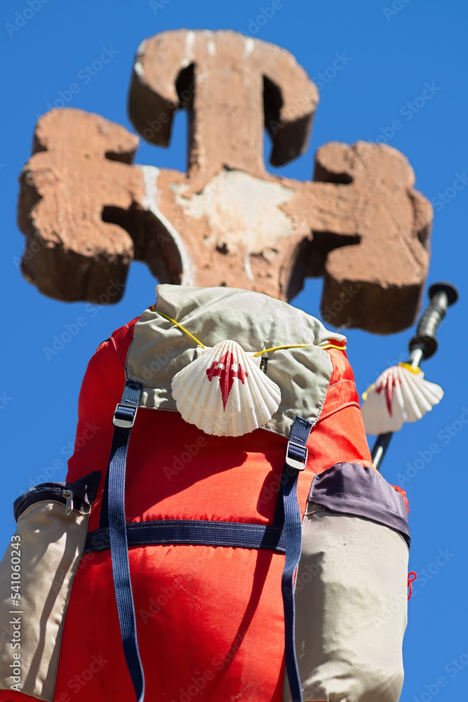 scallop shell on pilgrim backpack on a large cross of the saint on Camino de Santiago  to Compostela , in  León, Spain