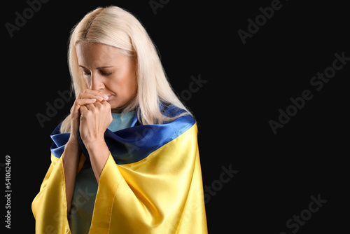 Mature woman with flag of U...